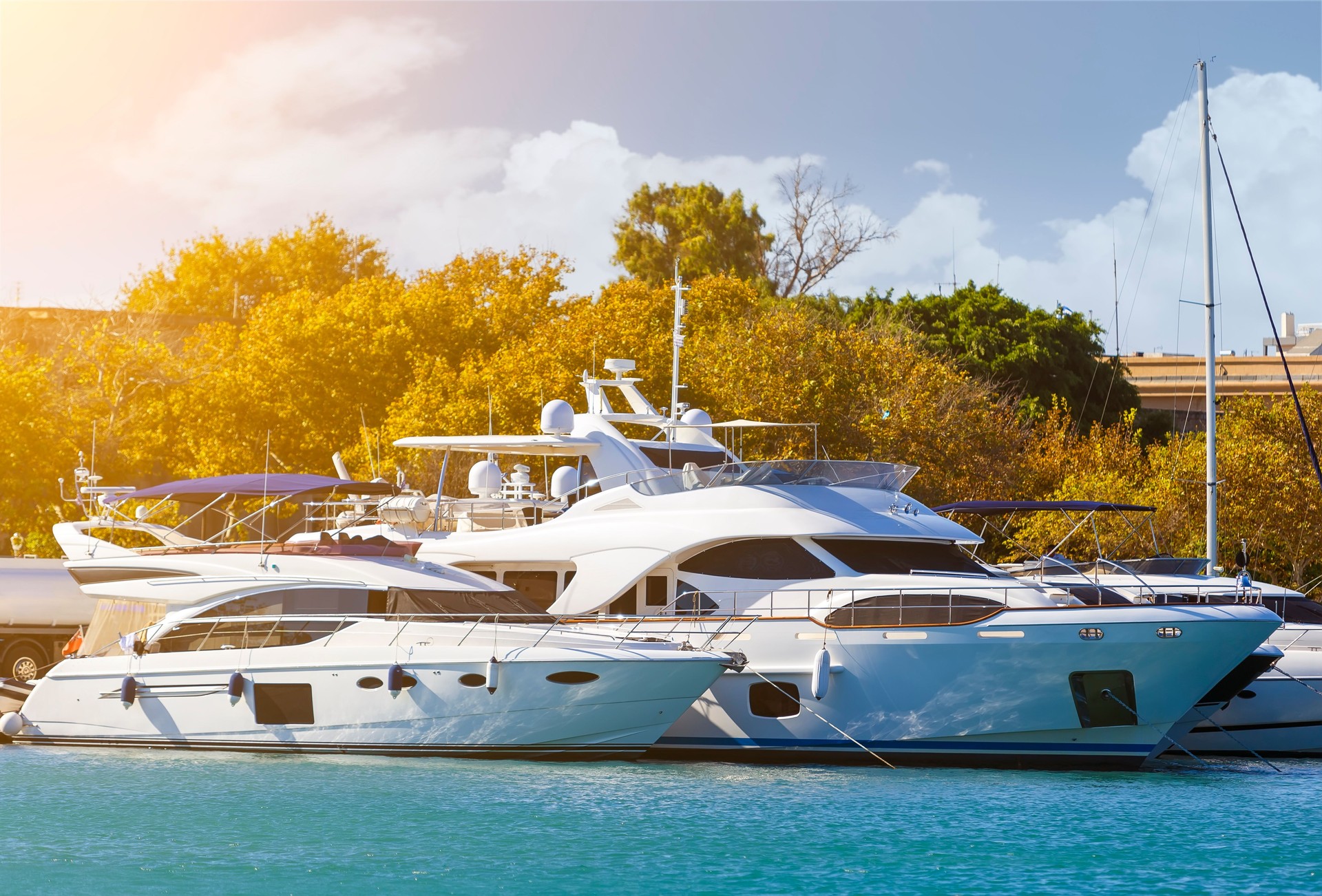 large white modern motor superyacht in the port city of Rhodes Greece